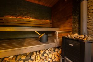 a stove and oven in a room with wood